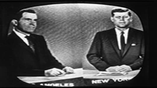 Presidential candidates Richard Nixon and John F. Kennedy during a televised debate.