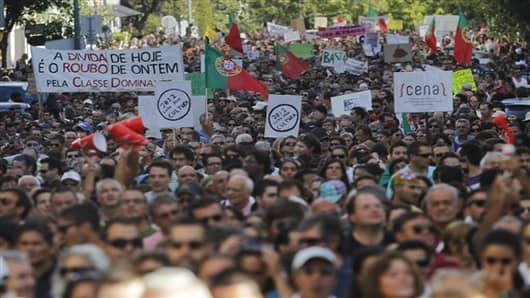 Demonstrators march during a protest against economic austerity measures in Portugal