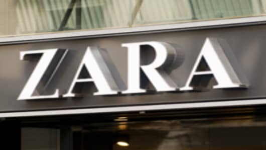 A logo sits above the entrance to a Zara fashion store, operated by Inditex SA, in Barcelona, Spain.