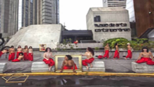 Topless women outside Caracas Museum of Contemporary Art protest for return of Henri Matisse painting.