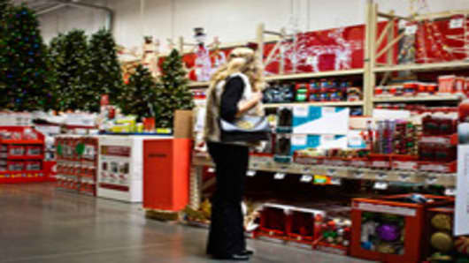 A customer shops in the holiday decorations area at a Home Depot store.