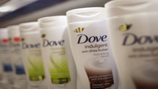 Bottles of Dove body lotion, manufactured by Unilever NV, are seen in a supermarket in Slough, U.K., on Monday, Sept. 3, 2012. U.K. retail same-store sales barely rose in July, according to the British Retail Consortium, as consumer confidence was undermined by the double-dip recession and the euro-area debt crisis