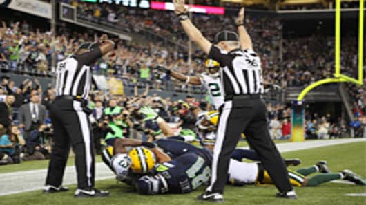 Wide receiver Golden Tate #81 of the Seattle Seahawks makes a catch in the end zone to defeat the Green Bay Packers on a controversial call by the officials at CenturyLink Field on September 24, 2012 in Seattle, Washington.