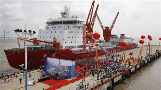 In this photo provided by China's Xinhua News Agency,  Chinese icebreaker Xuelong, or Snow Dragon, is harbored in Shanghai,  after an 85-day scientific quest across the Arctic ocean, Thursday, Sept. 27, 2012.  The Chinese icebreaker has docked at Shanghai after becoming the first Chinese vessel to cross the Arctic Ocean. (AP Photo/Xinhua, Pei Xin) NO SALES