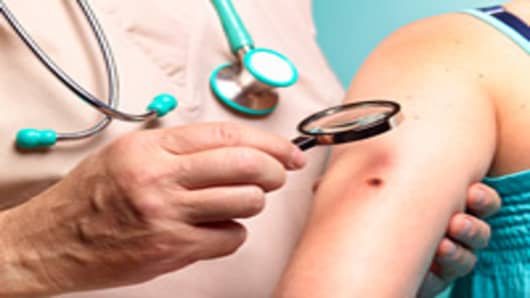 Doctor examining skin cancer