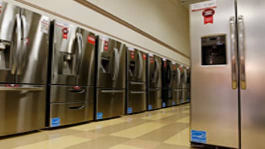 Refrigerators stand on display at a Conn's Inc. store in Houston, Texas, U.S., on Tuesday Sept. 4, 2012.