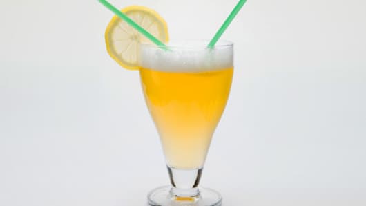 Glass of shandy with slice of lemon