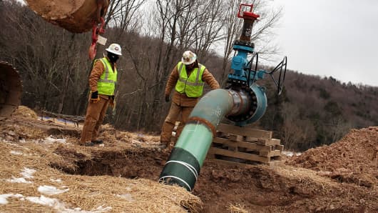 Men with Cabot Oil and Gas work on a natural gas valve at a hydraulic fracturing site on January 18, 2012 in South Montrose, Pennsylvania.