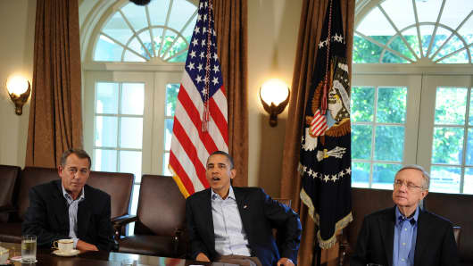 House Speaker John Boehner, President Obama and Sen. Harry Reid.