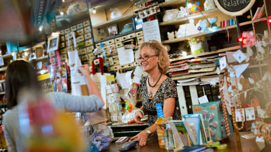 Laura Massey smiles as she talks to a customer at Beetz Me in Princeton, Illinois.