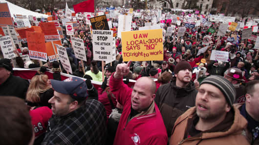 Union members from around the country rally at the Michigan State Capitol to protest a vote on Right-to-Work legislation December 11, 2012 in Lansing, Michigan.