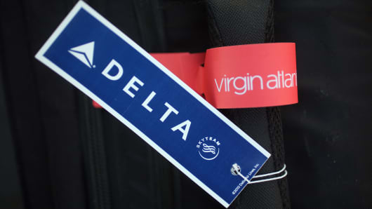 Delta Airlines baggage tags are affixed on the handle of luggage on December 11, 2012 in Manchester, England.