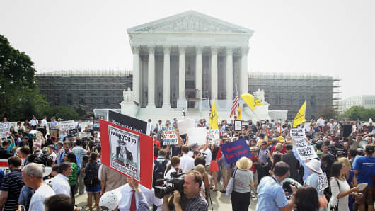 Obamacare supporters and protesters gather in front of the U.S. Supreme Court to find out the ruling on the Affordable Health Act June 28, 2012 in front of the U.S. Supreme Court in Washington, DC.