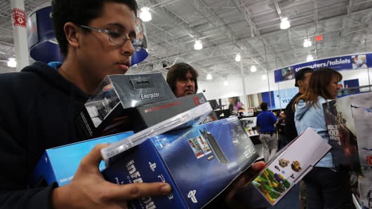 Shoppers move through a Best Buy store.