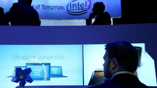 Attendees inspect Intel UltraBooks during the 2013 International CES at the Las Vegas Convention Center.