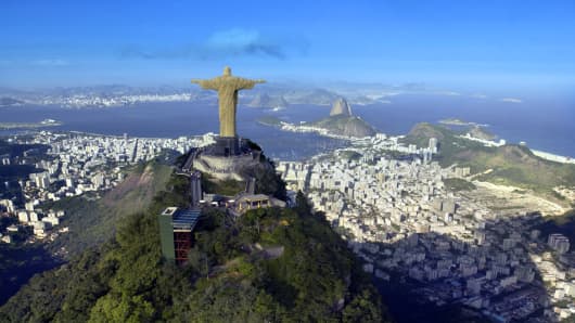 Aerial view of Christ the Redeemer Monument in Coreovado overlooking the city and Sugarloaf Mountain - Rio de Janeiro in Brazil.