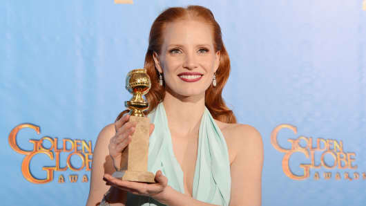 Jessica Chastain poses after winning the Best Actress Golden Globe Award for her role in Zero Dark Thirty.