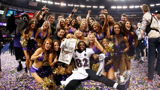 Torrey Smith of the Baltimore Ravens celebrates with the Ravens cheerleaders after winning Super Bowl XLVII.