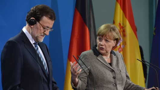 German Chancellor Angela Merkel and Spain's Prime Minister Mariano Rajoy address a press conference at the Chancellery in Berlin on February 4, 2013 after their meeting.