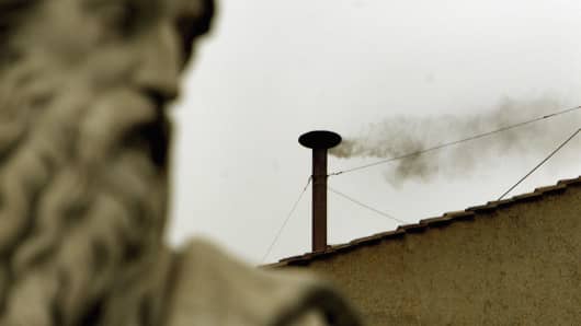 Black smoke is seen from the roof of the Sistine Chapel.