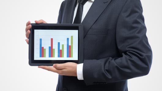 Businessman stock charts tablet