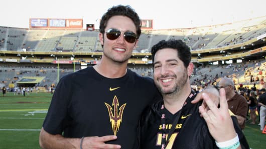 Former ASU quarterback Brock Osweiler, pictured at far left, and fan Jonathan Leiterman, who used startup Fandeavor.
