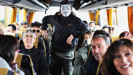 Supporters and activists from Livorno of the Movimento 5 Stelle, Five Star Movement go by bus to attend the last political rally of Beppe Grillo, leader of the Movimento 5 Stelle before the national election on February 22, 2013 in Rome, Italy.