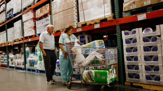 Customers shop at a Costco store.