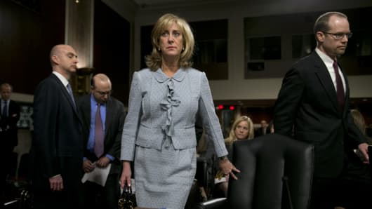 Ina Drew, former chief investment officer with JPMorgan Chase & Co., center, arrives to a Senate Permanent Subcommittee on Investigations hearing