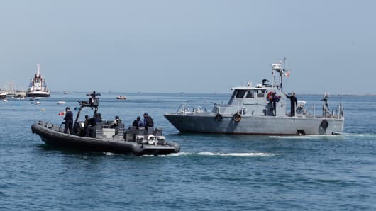 Egyptian coast guard vessels patrol the Suez Canal.