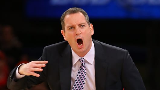 Head coach Mike Rice of the Rutgers Scarlet Knights shouts instructions to his team during the second round of the Big East Tournament at Madison Square Garden in New York City.