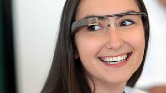 An employee wearing a pair of Google Glass