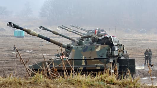 South Korean marines man K-55 self-propelled howitzers at a military training field in the border city of Paju on April 3, 2013.
