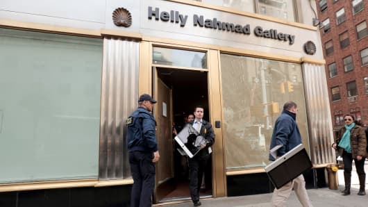 Federal agents remove computers from the Helly Nahmad Gallery at the Carlyle Hotel in New York.