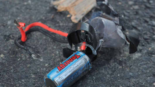 Boston Marathon bomb scene pictures taken by investigators show the remains of an explosive device.