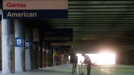 Logan Airport at 7 a.m., Terminal B.  Early morning light and a lone curbside cleaner is about all that is at Terminal B on the second day of the lockdown.