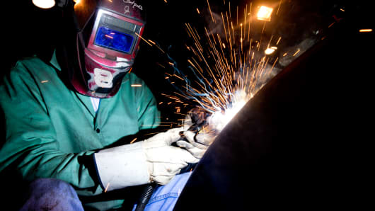 A welder builds parts for finished petroleum tanks at Southern Tank and Manufacturing in Owensboro, Kentucky.