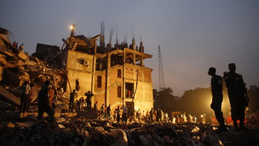 Rescue workers look for trapped garment workers in the collapsed Rana Plaza building in Savar.