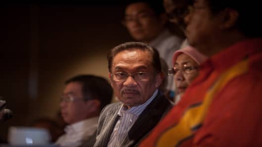 Anwar Ibrahim, Malaysia's opposition leader, listens during a news conference on Sunday, May 5, 2013.