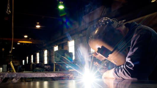 A welder builds parts for finished petroleum tanks at Southern Tank and Manufacturing Inc. in Owensboro, Kentucky, U.S.
