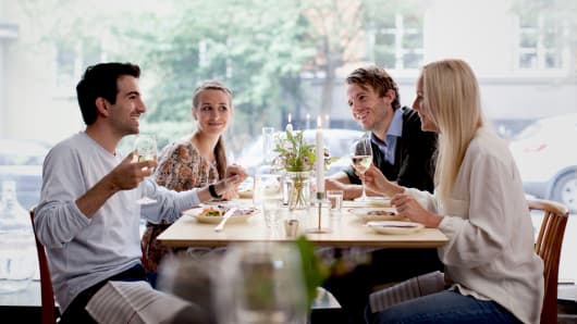 premium: group eating out at restaurant