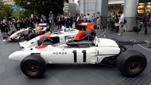 The three-generation Honda Formula One cars, (front to rear)1965 Honda RA272, 1988 McLaren Honda MP4/4 and 2006 Honda RA106.