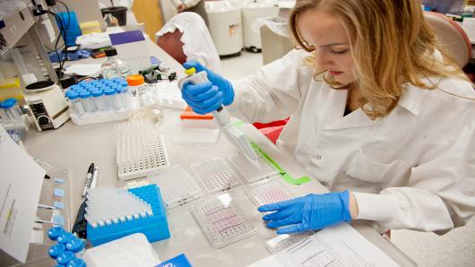 Research technician Hannah Salk prepares human cell samples for vaccine studies in the vaccine research laboratory at the Mayo Clinic medical center in Rochester, Minnesota, U.S.
