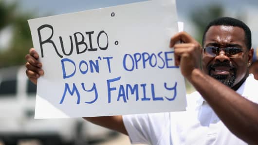 A protester in front of Sen. Marco Rubio's (R-FL) office on May 22, 2013 in Doral, Florida.