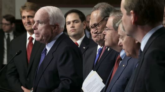 Sen. John McCain (R-AZ) (2nd L) speaks as (L-R) Sen. Jeff Flake (R-AZ), Sen. Marco Rubio (R-FL), Sen. Richard Durbin (D-IL), Sen. Chuck Schumer (D-NY), Sen. Bob Menendez (D-NJ), Sen. Lindsey Graham (R-SC), an