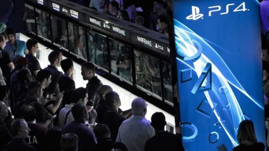 Attendees try out Sony Playstation 4 at the E3 Electronic Entertainment Expo in Los Angeles, CA, June 11, 2013
