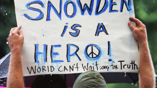 A supporter holds a sign at a small rally in support of National Security Administration (NSA) whistleblower Edward Snowden in Manhattan's Union Square on June 10, 2013 in New York City.