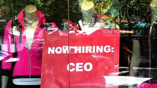 A CEO Help Wanted sign is on display inside a Lululemon storefront in Toronto.