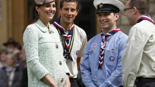 Catherine, Duchess of Cambridge talks with Chief Scout Bear Grylls (2nd L) and Sea Scout Rob Butcher (2nd R) as she attends the National Review of Queen's Scouts at Windsor Castle on April 21, 2013.