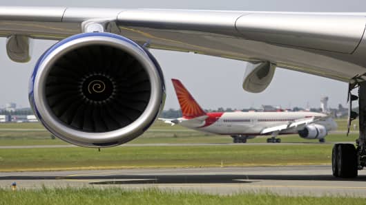 A Boeing Co. 787 Dreamliner aircraft passes behind the engine of a Airbus SAS A380 aircraft on the first day of the Paris Air Show.